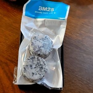 A pair of Black Sesame Stone Double Flared Ear plugs